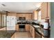 Well-equipped kitchen featuring granite counters and stainless appliances at 17606 Se 93Rd Butler Ct, The Villages, FL 32162