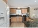 Bright kitchen featuring granite counters and ample cabinet space at 17606 Se 93Rd Butler Ct, The Villages, FL 32162