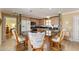 Modern kitchen with granite countertops and wood cabinets at 17606 Se 93Rd Butler Ct, The Villages, FL 32162