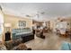 Comfortable living room with light floors and seating at 17606 Se 93Rd Butler Ct, The Villages, FL 32162