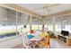 Sunroom with table and chairs, offering backyard views at 17606 Se 93Rd Butler Ct, The Villages, FL 32162