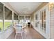 Bright sunroom with tiled floor and access to backyard at 17606 Se 93Rd Butler Ct, The Villages, FL 32162