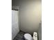 Bathroom with tile floor, toilet, and shower with white curtain at 1936 Se 37Th Court Cir, Ocala, FL 34471