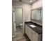 Updated bathroom with granite countertop and modern vanity at 1936 Se 37Th Court Cir, Ocala, FL 34471
