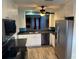 Updated kitchen with stainless steel appliances, granite countertops, and stylish cabinetry at 1936 Se 37Th Court Cir, Ocala, FL 34471