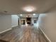 Open-concept living room featuring a fireplace, skylights, and neutral color palette at 1936 Se 37Th Court Cir, Ocala, FL 34471