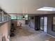 Covered patio with concrete flooring, skylight, a ceiling fan, and multiple access points at 1936 Se 37Th Court Cir, Ocala, FL 34471