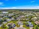Expansive aerial view of a beautifully landscaped community with a golf course and multiple lakes at 2630 Dunbar Ave, The Villages, FL 32162