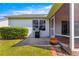 Cozy backyard patio with BBQ grill, accessible from the screened lanai, perfect for outdoor dining at 2630 Dunbar Ave, The Villages, FL 32162