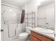 This bathroom features a walk-in bathtub with shower and a modern vanity with granite countertops at 2630 Dunbar Ave, The Villages, FL 32162