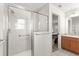 Bright bathroom featuring walk-in shower, granite counters, and neutral tile floor at 2630 Dunbar Ave, The Villages, FL 32162