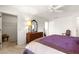 Bedroom featuring neutral carpet, ceiling fan, and large closet for storage at 2630 Dunbar Ave, The Villages, FL 32162