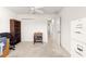 Neutral bedroom featuring carpet, ceiling fan, closet, and office furnishings for comfort and organization at 2630 Dunbar Ave, The Villages, FL 32162