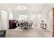 Bright dining area with a round table, chairs, and a peek into the kitchen at 2630 Dunbar Ave, The Villages, FL 32162
