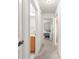 Hallway with a view of the bathroom and bedroom, showcasing the home's layout at 2630 Dunbar Ave, The Villages, FL 32162