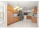 Open kitchen featuring stainless steel appliances, ample cabinet space, and bright lighting at 2630 Dunbar Ave, The Villages, FL 32162