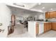 Open living room with tile floors, natural lighting and open view to living room at 2630 Dunbar Ave, The Villages, FL 32162