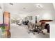 Bright living room featuring high ceilings, neutral colored walls, and sliding door to the screened lanai at 2630 Dunbar Ave, The Villages, FL 32162