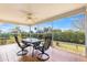 Covered screened patio featuring a ceiling fan and views of a backyard at 2630 Dunbar Ave, The Villages, FL 32162