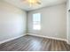 Bright bedroom with wood-look floors and a window at 3219 Se 43Rd Ave, Ocala, FL 34480