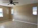 Spacious bedroom with tile floors and ceiling fan at 3807 Sw 143Rd Lane Rd, Ocala, FL 34473