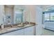 Double vanity bathroom with granite countertop and walk-in shower at 4062 Nw 44Th Cir, Ocala, FL 34482
