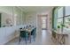 Elegant dining room with green velvet chairs and a modern table at 4062 Nw 44Th Cir, Ocala, FL 34482