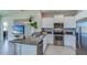 Spacious kitchen with granite island and stainless steel appliances at 4062 Nw 44Th Cir, Ocala, FL 34482