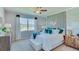 Spacious bedroom with a large window and stylish geometric wall decor at 4062 Nw 44Th Cir, Ocala, FL 34482