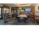 Game room with pool table, TVs and comfortable seating at 4068 Nw 44Th Cir, Ocala, FL 34482