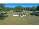 Aerial view of a ranch-style home on a large lot with mature trees at 4248 Ne 175Th Street Rd, Citra, FL 32113