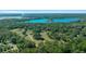 Aerial view of a large property with lake views at 4248 Ne 175Th Street Rd, Citra, FL 32113