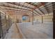 Spacious barn interior with concrete floor and stalls at 4248 Ne 175Th Street Rd, Citra, FL 32113