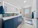 Updated bathroom with a double vanity and walk-in shower at 4248 Ne 175Th Street Rd, Citra, FL 32113