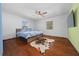 Bright bedroom with hardwood floors and a comfy bed at 4248 Ne 175Th Street Rd, Citra, FL 32113