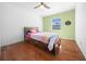 Charming bedroom with hardwood floors and a twin-size bed at 4248 Ne 175Th Street Rd, Citra, FL 32113