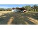 Covered carport with space for two cars and lawn equipment at 4248 Ne 175Th Street Rd, Citra, FL 32113