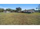 View of house and detached garage from the yard at 4248 Ne 175Th Street Rd, Citra, FL 32113