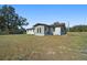 Back view of ranch house with covered patio at 4248 Ne 175Th Street Rd, Citra, FL 32113