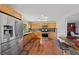 Eat-in kitchen with stainless steel appliances and wood cabinets at 4248 Ne 175Th Street Rd, Citra, FL 32113