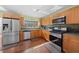 Modern kitchen with stainless steel appliances and wood cabinets at 4248 Ne 175Th Street Rd, Citra, FL 32113