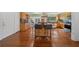 Kitchen features wood flooring, an island, and wood cabinets at 4248 Ne 175Th Street Rd, Citra, FL 32113