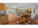 Bright kitchen with island, stainless steel appliances, and wood flooring at 4248 Ne 175Th Street Rd, Citra, FL 32113