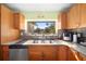 Kitchen with double sink, wood cabinets, and a view at 4248 Ne 175Th Street Rd, Citra, FL 32113
