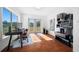 Home office with built-in shelving and large windows at 4248 Ne 175Th Street Rd, Citra, FL 32113