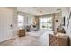Spacious living room with access to the front door and view of the kitchen at 4742 Nw 39Th Street Rd, Ocala, FL 34482