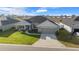 Single-Gathering home, two-car garage, and well-maintained lawn at 5826 Sw 83Rd Ln, Ocala, FL 34476