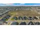 Aerial view of a residential neighborhood with houses and open space at 5826 Sw 83Rd Ln, Ocala, FL 34476