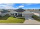 Single-Gathering home, two-car garage, and well-maintained lawn at 5826 Sw 83Rd Ln, Ocala, FL 34476