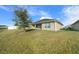 Spacious backyard with a large grassy area and a partially visible fence at 5826 Sw 83Rd Ln, Ocala, FL 34476